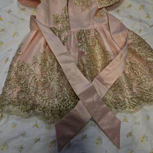 Baby girl medium size peach/ salmon dress with pearls trim
